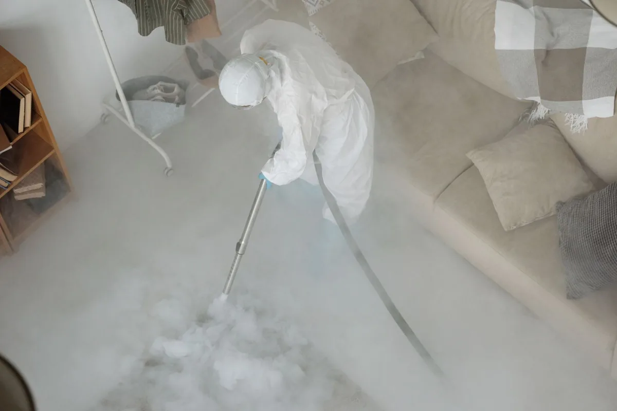 Biohazard cleanup technician in protective equipment, Fair Plain, MI